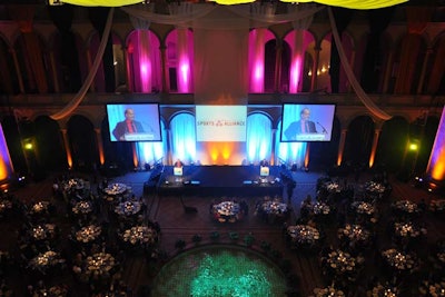 Syzygy Event Productions draped the ceiling above the dinner tables and the backdrop of the main stage.