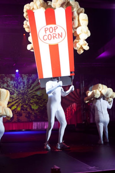 Tying into the circus theme, Universal Orlando's StudiOut's entry in the headdress competition was an huge container of popcorn with two performers dressed like smaller pieces of popcorn alongside it.