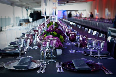 Slate gray and purple linens topped with clear, black, and white place settings decorated the dinner tables.