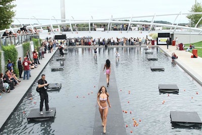 South Moon Under showcased its latest line in a swimwear fashion show on a stage erected in the reflecting pool of the park.