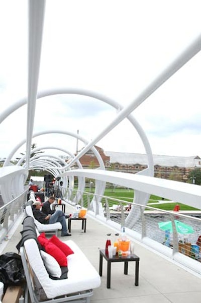 White and black sofas with bottle service lined the bridge above the pool for those attendees who purchased the $125 Rockstar ticket.