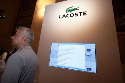 Columns surrounding the space featured the fragrance branding and built-in flat-screens for the ad copy loop, live video from the event's aerial cameras, and the feed from Lacoste's Twitter account.