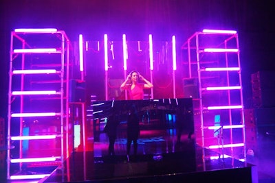 Bright tube lighting surrounded the black mirrored DJ booth.