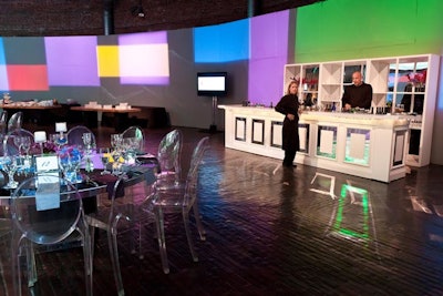Color-block lighting along a curved perimeter of the room was inspired by the Gene wall at the Yawkey Center. Filled with colorful, illuminated cubes, the curving wall has tributary plaques that honor individuals affected by cancer.