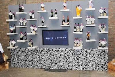 Ribbon-tied bottles from sponsor Moët & Chandon surrounded a flat-screen TV that showcased designer David Meister's name.