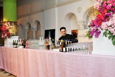 W. Andrew Holitik provided towering floral arrangements for the bars.