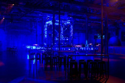 The 20-foot by 30-foot bar and DJ booth were constructed out of truss for an industrial look that referenced the fighting ring in the film Real Steel.