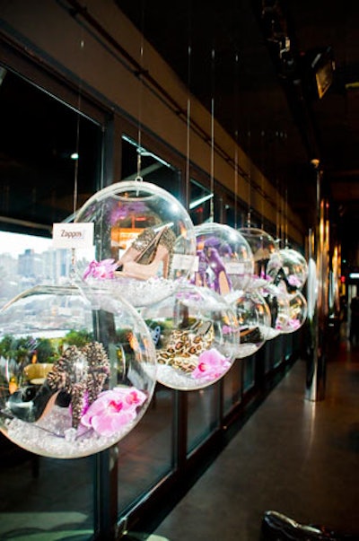 Acrylic balls hung from the ceiling, housing edgy heels and booties.