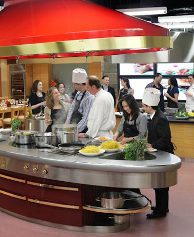 The Action Kitchen lets groups divide into teams to cook up seasonal meals using market ingredients. Professional chefs are on hand to offer guidance.