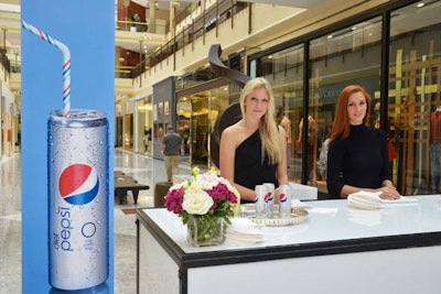 Pepsi set up a Diet Pepsi bar near the Maserati Men's Lounge, with models serving the beverage in its new 'skinny' can.