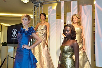 Models posed on pedestals on the roving runways positioned around the mall.