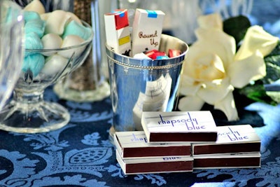 Candy cigarettes and matchboxes topped tables.