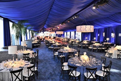 Blue fabric inspired by the Art Deco period draped the ceiling.