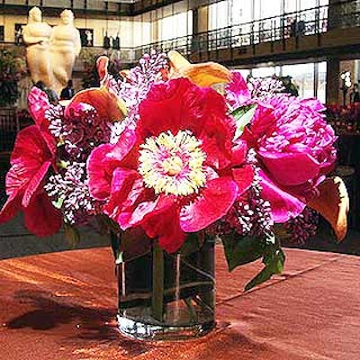 Carter Field covered tables with rust-colored cloths and created centerpieces that included lilacs and peonies.