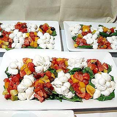 Restaurant Associates' menu included antipasti of cheese with arugula and heirloom tomatoes in a balsamic dressing.