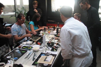 A group learns how to roll sushi and pair it with sake at China Grill Hilton Fort Lauderdale Marina.