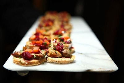 During the V.I.P. reception, RSVP Catering served five hors d'oeuvres, including a mousse de foie gras on a red wine biscotti topped with red and yellow beet relish.
