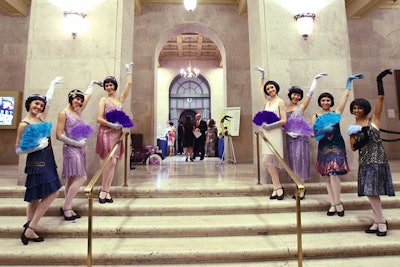 Entertainers dressed as 1920s flappers served as greeters.