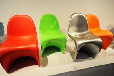 The Panton Chair is available in red, silver, orange, and green.
