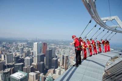 EdgeWalk has groups of six to eight walking the circumference of the CN Tower, 356 metres above the ground.