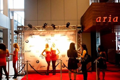 Guests could pose with models on the red carpet before entering Sharp: The Book for Men launch party at Aria Ristorante.