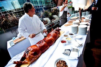 Aria chefs grilled steaks and served slow roasted porchetta outside.