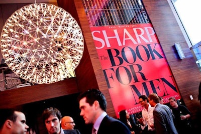 Blown-up covers of Sharp: The Book for Men hung on the walls of the restaurant. The event's red and black colour scheme was drawn from the cover.