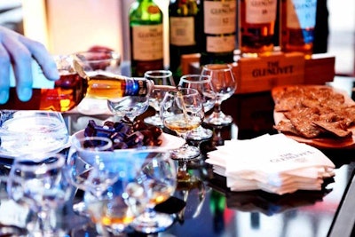 In the Editor's Lounge, guests received a scotch tasting tutorial and sampled 12-, 15-, and 18-year-old Glenlivet.