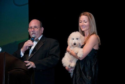 The live auction included tickets to sporting events, vacations, a painting, and a Goldendoodle puppy.