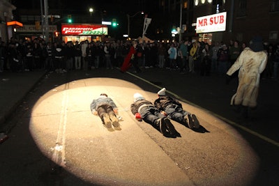 Two streetlights were replaced with theatre spotlights for Limelight: Saturday Night. Three guests practiced planking for their moment of fame.