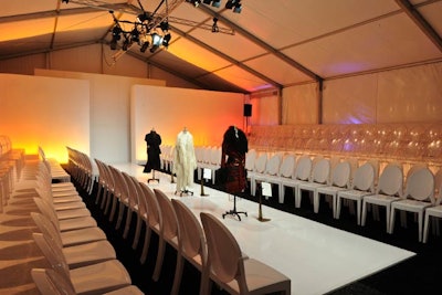 The tent had 250 white and clear Louis chairs.
