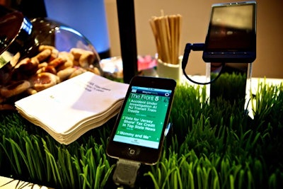 Grassy turf served as the backdrop for the back porch bar, where cell phones showed off Patch.com's iPhone app.