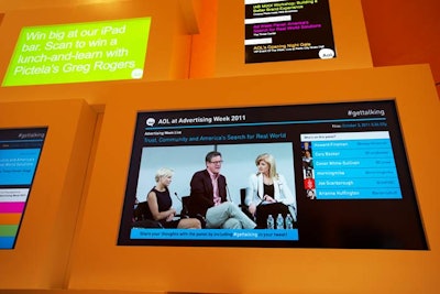 Above a centrally located information desk was a five-screen display that showed video streams, event updates, and tweets using AOL's #gettalking hashtag.