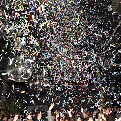 At the post-dinner Studio Party for 750 guests, 60 pounds of confetti, made with metal foil strips in colors like ruby, sapphire, emerald, topaz, and amethyst, exploded over the dance floor. Again, as a response to the size of the space, van Wyck hung not one, but three four-foot disco balls.