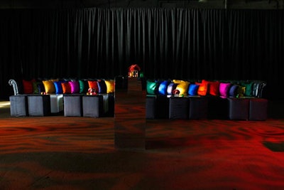 Van Wyck utilized 34 different colors of raw silk in the tablecloths and chair and pillow covers. The cocktail reception, which took place in the same space as the postdinner Studio Party, featured two long seating areas topped with colorful pillows.