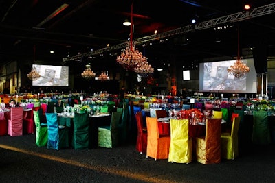 Sixty tables accommodated 660 guests for dinner, the largest audience the Whitney has ever hosted at its gala. Four massive screens surrounded the approximately 5,900-square-foot dinner area, showcasing the work of contemporary artist Marilyn Minter.