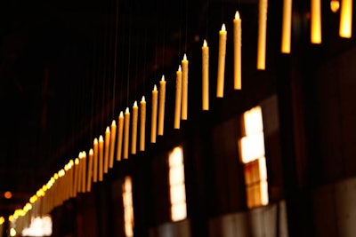 Suspended candles lined a 100-foot-long portion of the walkway between the cocktail space and dinner area.