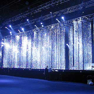 For the cocktail area at Robin Hood's benefit, Avi Adler and David Stark designed a dramatic installation of hundreds of sparkling strands of crystal beads hanging over an 80-foot by 10-foot black platform with a shallow reflecting pool.