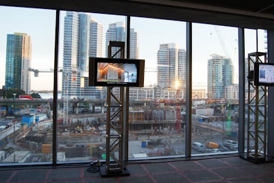 Two separate rooms displayed screens with a promotional video from Sci Energy. One room was directed at clients interested in retrofitting a building with the software and the other was for clients building from the ground up.