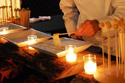Chefs prepared maple taffy on snow in front of guests.