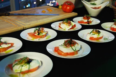 Chefs served buffalo mozzarella, heirloom tomatoes, and basil topped with Niagara prosciutto from a station.