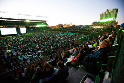 Green lighting bathed the ballpark in Groupon's signature hue. Approximately 8,500 guests attended the screening.