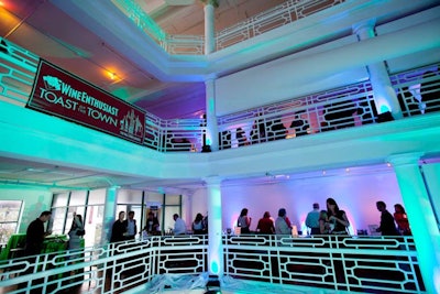 The first Taste of the Town event in Miami took place in the historic Moore Building, with blue lighting illuminating the interiors.
