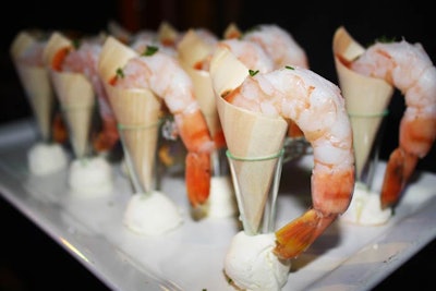 Hard Rock Cafe served shrimp cocktail in parchment funnels.