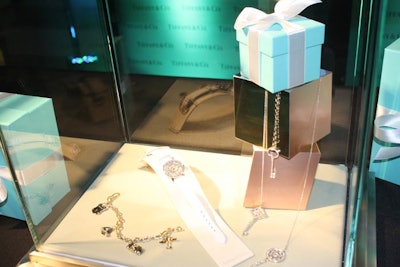 Tiffany & Company used glass cases to display jewelry at its booth.