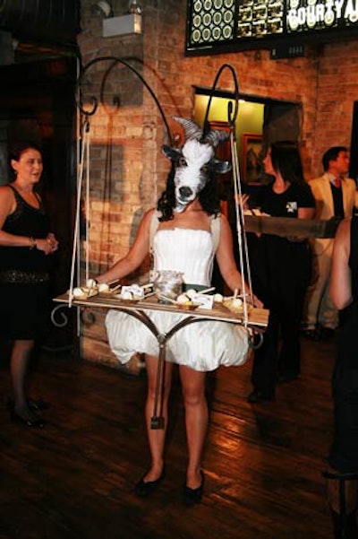 A Redmoon performer donned a goat's mask and served desserts from a hanging tray.
