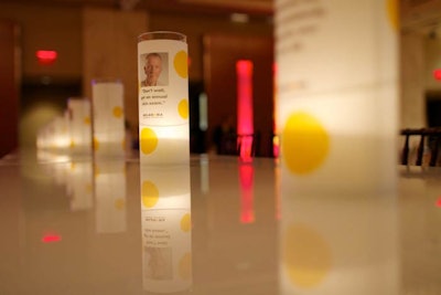 Yellow and white votive candleholders held information about the foundation's work.