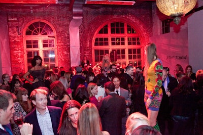 The event took place at the Cyclorama, which High Output bathed in pink light. Performance Platforms provided staging for informal modeling during the cocktail hour, where guests sipped 'Pink Ribbon' martinis and 'Hope and Courage' fizzes.