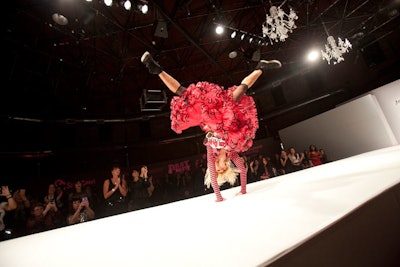 The designer performed her signature cartwheel on the runway, which was carpeted to support the feat.