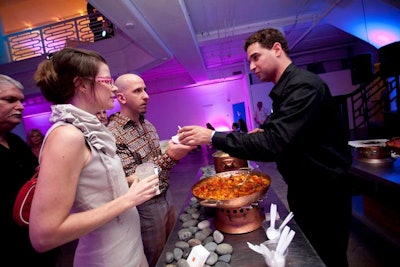 From a food station, caterer Lyon & Lyon served hot dishes to guests.